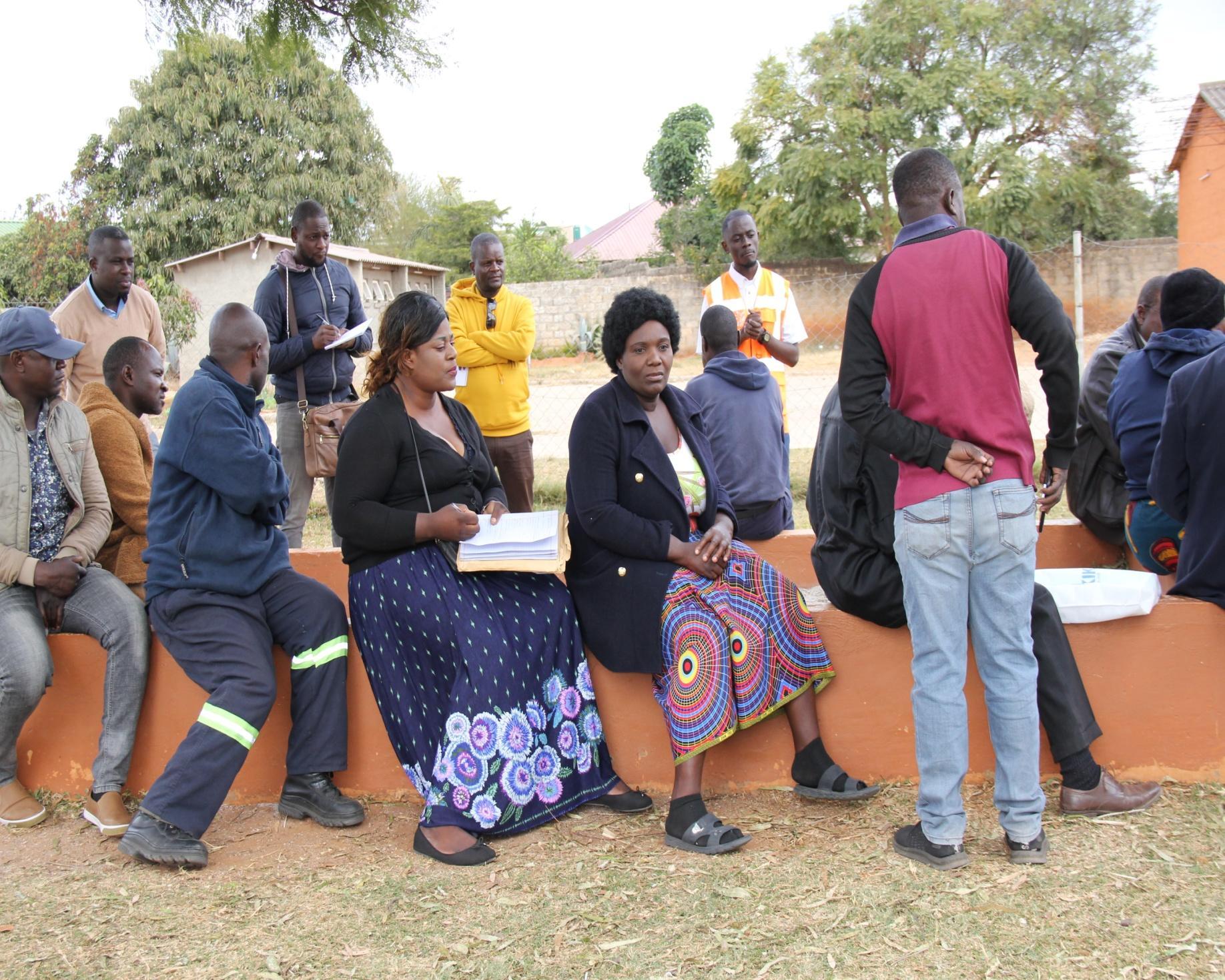 ZRST and community participants discussing climate and mobility risks during the HOT-supported open-mapping project in Lusaka