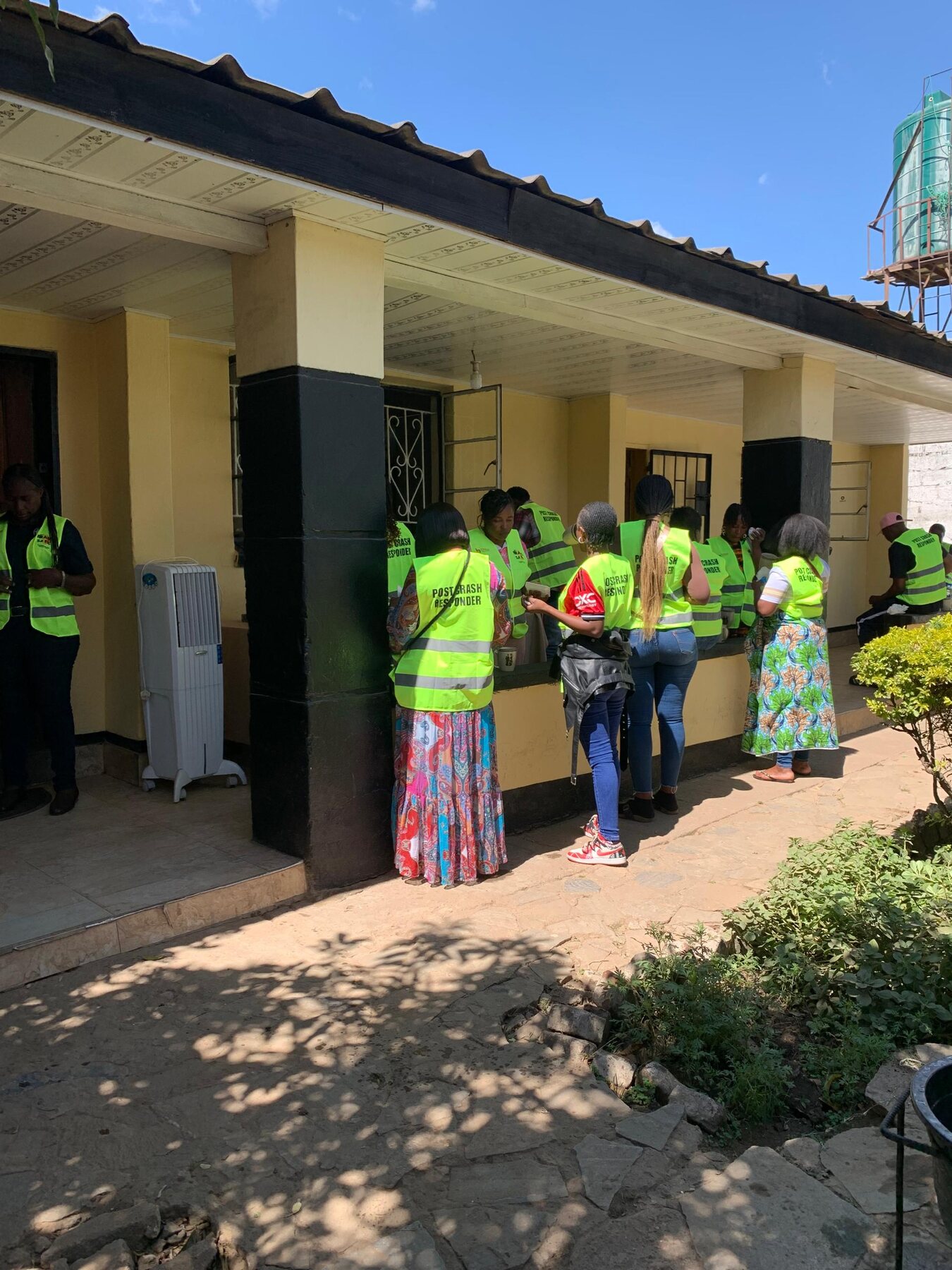 ZRST and partner representatives wearing reflective vests during a street-safety field visit in Lusaka