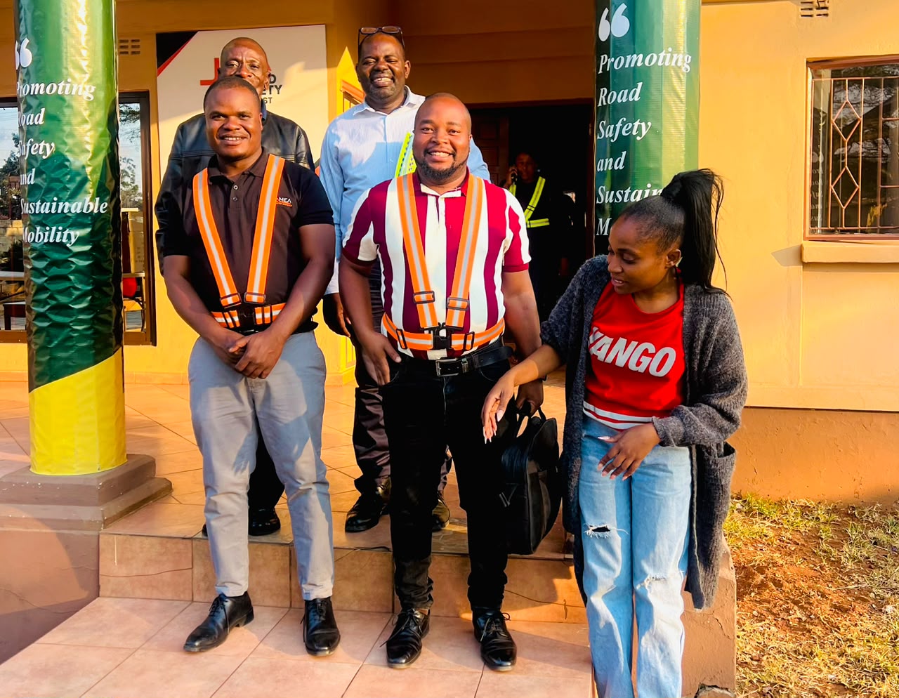 ZRST Motor Driving School staff with RTSA inspectors outside the ZRST office during the evaluation visit on 7 August 2026.